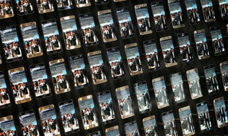 Visitors view a display of Samsung Galaxy S6 Edge smartphones at a consumer electronics fair in Berlin, Germany,
