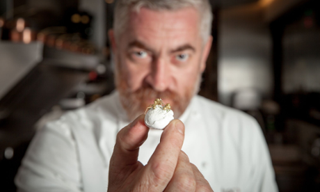 Chef Alex Atala shows off his golden Amazonian ants over a coconut meringue.