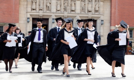 Graduates leave the Great Hall after a degree ceremony at Birmingham University 