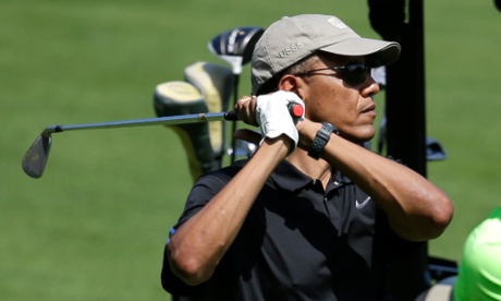 President Barack Obama flashes a glimpse of the red Game Golf sensor, pressed into the grip of his golf club.