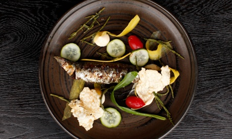 The charred sardine 'comes away easily from the bone because to do otherwise would be bad manners'.