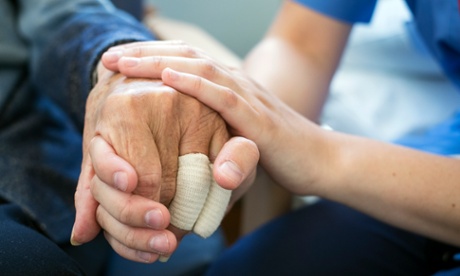 A nurse cares for a patient