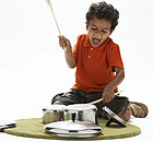 Child playing drums on saucepans