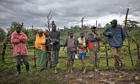 Some of the residents of the Mau forest in Kenya stand by the roadside. Photograph: Finbarr O'Reilly / Reuters
