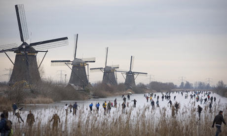 Windmills in Holland. With much of the country already below sea level, even a small rise would be devastating for the Dutch. Photograph: Peter Dejong/AP
