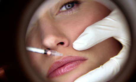 A woman receives a Botox injection