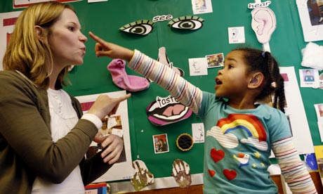 A deaf child learning to sign
