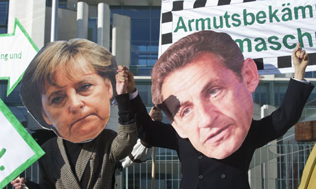 Protesters in Berlin dressed as German chancellor Angela Merkel and French president Nicolas Sarkozy ahead of Sunday's EU summit.