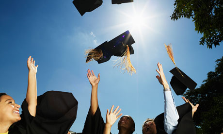 Graduates throw their hats into the air
