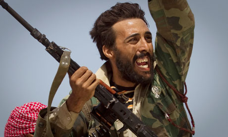 Gaddafi accuses rebels of Bin. A rebel soldier in Bin Jawad