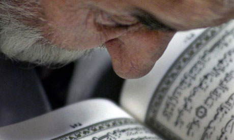 Iranian man reading Qu'ran