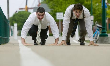 Two men in suits about to start a race