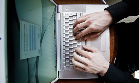 Hands on a computer keyboard