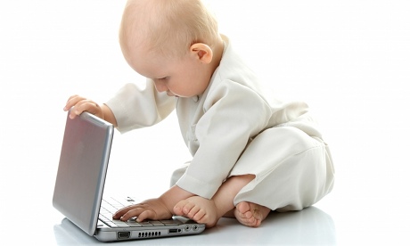 Baby playing with laptop