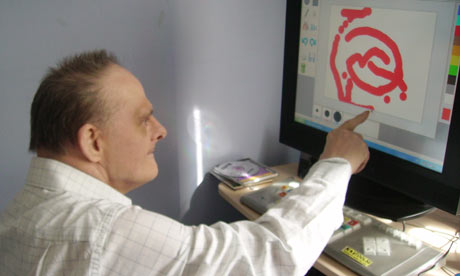 A client of St Anne's uses a touch-screen computer