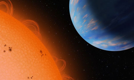 An artists concept of the Neptune-sized planet GJ436b (right) orbiting an M dwarf star, Gliese 436, at a distance of only 3 million miles. With a density similar to that of Neptune, the exoplanet is an ice giant and probably has a rocky core and lots of water that forms ice in the interior under high pressure and temperature.