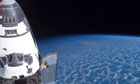Space Shuttle Endeavour, backdropped by the blackness of space and Earth's horizon