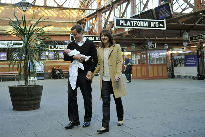 Tory fashion: David Cameron and wife Samantha with their baby daughter 