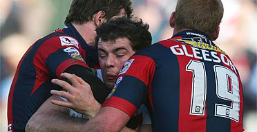 Paul Wellens tries to squeeze through a tackle