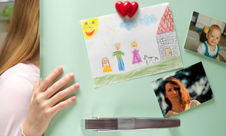 A girl looks in a family fridge