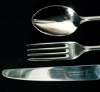 A knife, fork and spoon, cutlery