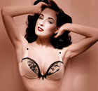 Dita von Teese wears peach satin lingerie from her Wonderbra range