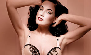 Dita von Teese wears peach satin lingerie from her Wonderbra range