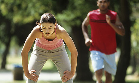 A woman resting mid-jog