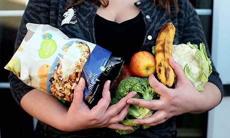 The Guardian's reluctant dieter holding healthy food