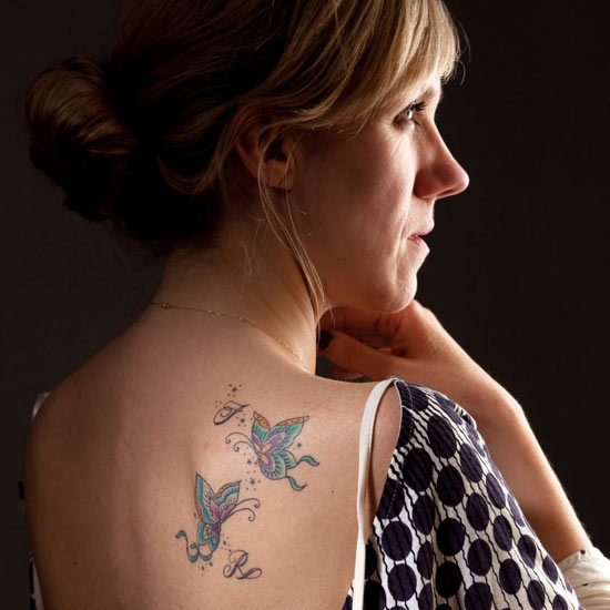 Claire Seeber's tattoo of butter ies with the initials of her sons Fen 