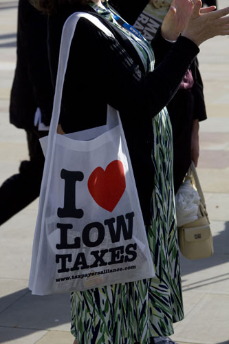 Tory conference fashion: A delegate with an I love low taxes bag