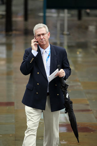 Tory conference fashion: A delegate uses his mobile phone