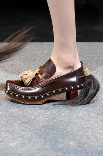 Wednesday's shows: A model wears a shoe by Louis Vuitton 