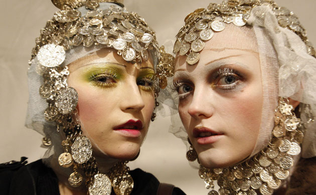 Hair accessories: Models wear headdresses by John Galliano