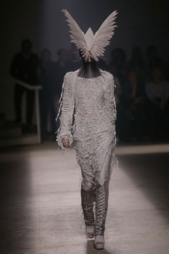 Hair accessories: A model wears an outfit by Gareth Pugh