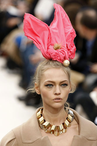 Hair accessories: A model wears an outfit by Louis Vuitton