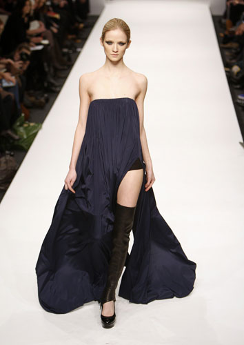 London fashion week: Noir: A model wears an outfit by Noir