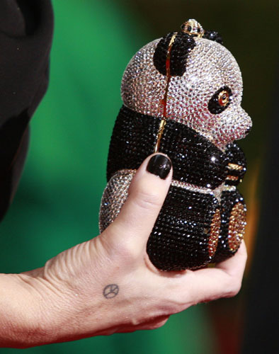 Oscars fashion gallery: Melissa Cobb with panda handbag 