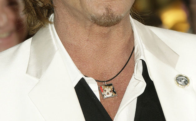 Oscars fashion gallery: Mickey Rourke wears a photo of his dead chihuahua