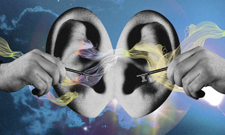 Two hands sticking keys in two ears