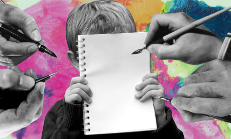 Boy holding notepad while adult hands are writing on it