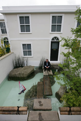 Chelsea weird stuff: Peter Dowle sits in his garden at Chelsea Flower Show