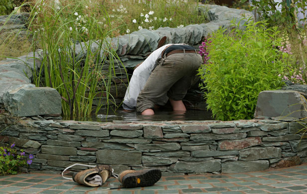 Tatton Park flower show: An exhibitor tends to his display