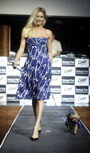 Paws for style: Jessica Hart walks her dog Cookie down the runway