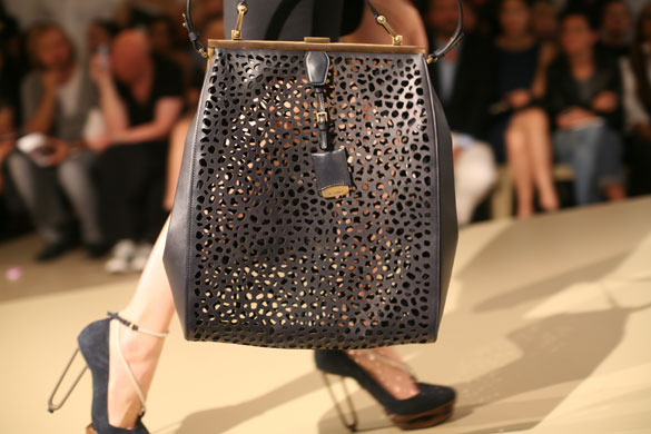 Observer fashion: A model carries a Jil Sander bag