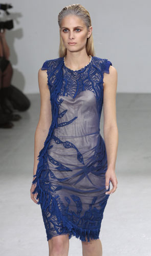 Paris fashion week: A model wears Tim Van Steenberg