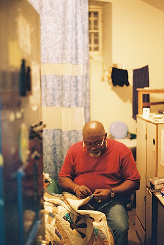 Fine Cell Work gallery: Prisoner doing embroidery 