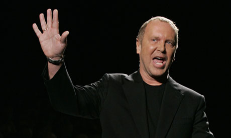 Michael Kors takes a bow at one of his shows