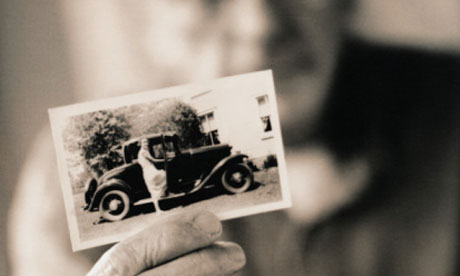 Man Holding a Vintage Photograph