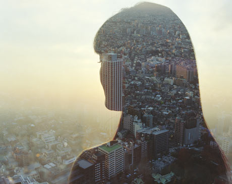 Cityscape and young woman, rear view